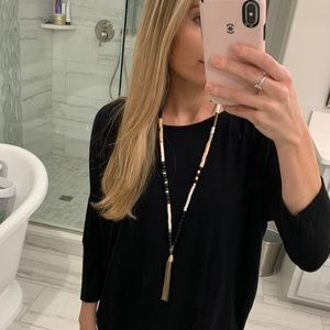 Long black and white necklace with tassel